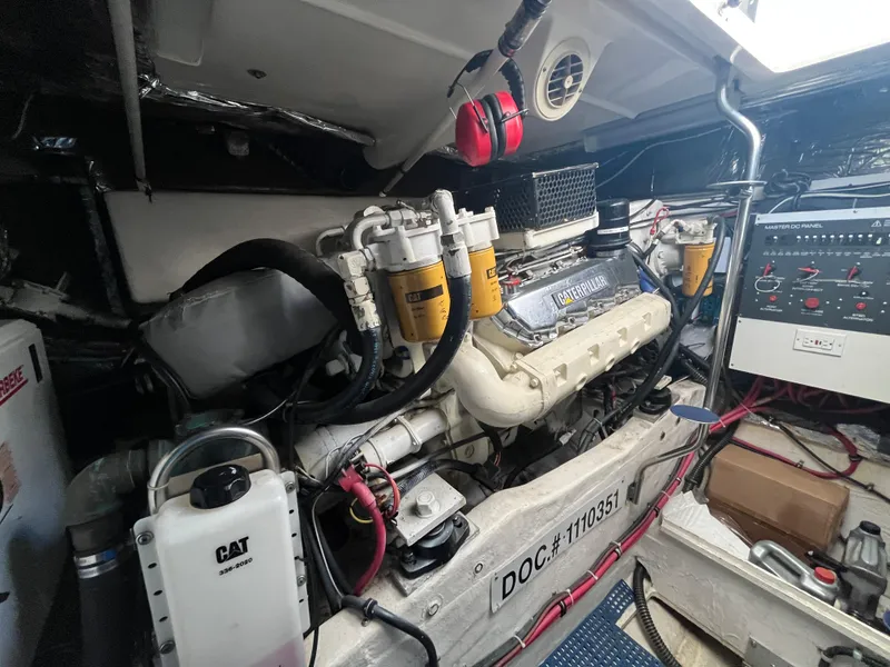 Slide: The Image of Engine room of 2001 Tiara Yachts 4100 Open, showcasing mechanical components and control panel. - 9