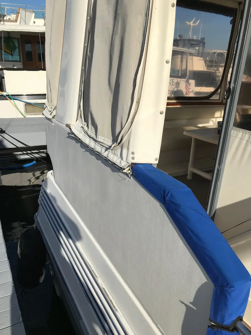 Slide: The Image of 1987 Sea Ray 410 Aft Cabin boat with blue and white exterior details. - 20