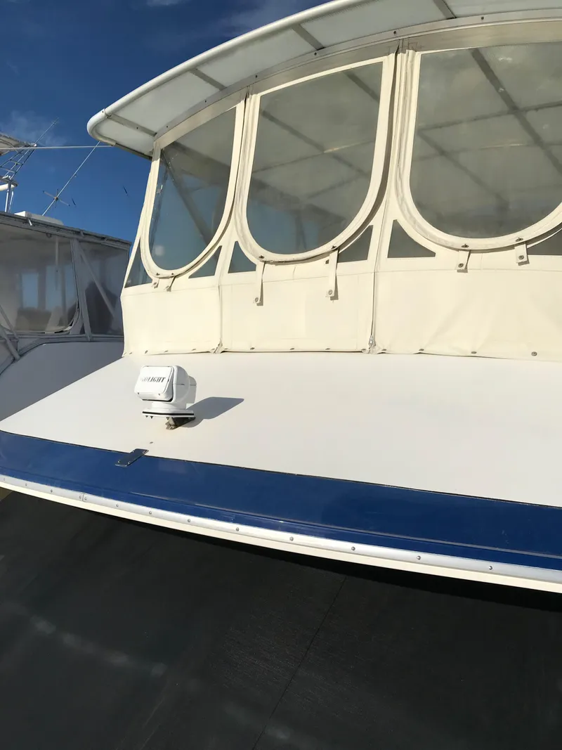 Slide: The Image of 1987 Sea Ray 410 Aft Cabin yacht with enclosed deck and radar. - 94