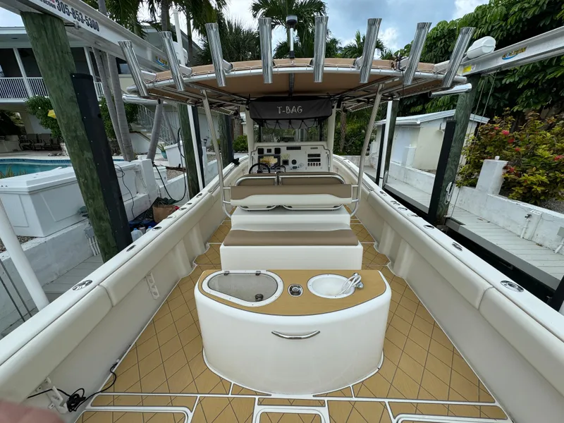 Slide: The Image of 2009 Mamba 350 boat interior with seating and fishing rod holders. - 14