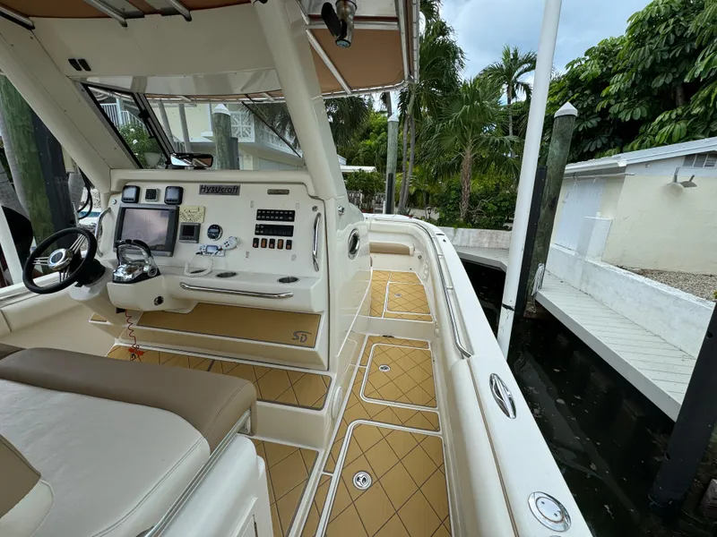 Slide: The Image of Interior view of a 2009 Mamba 350 boat, featuring a sleek control panel and seating. - 5