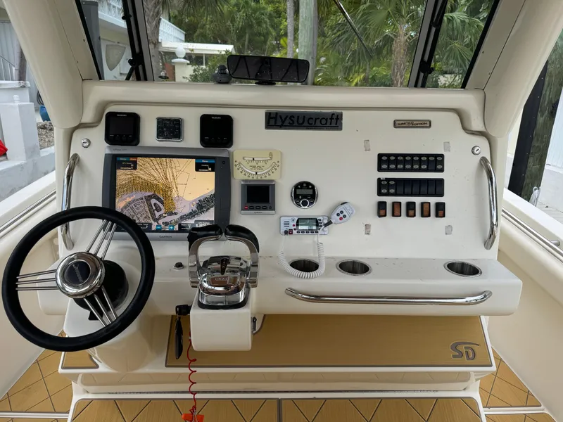 Slide: The Image of Control panel of a 2009 Mamba 350 boat with navigation equipment and steering wheel. - 6