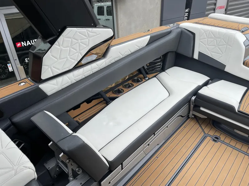 Slide: The Image of 2023 Nautique Super Air Nautique G25 Paragon interior with luxurious seating and modern design. - 7