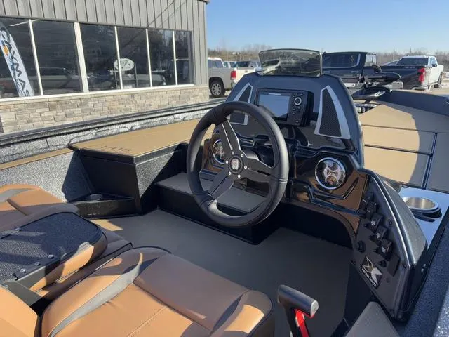 Slide: The Image of 2025 Xpress H18 boat interior with steering wheel and dashboard controls. - 5