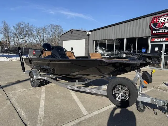 Slide: The Image of 2025 Xpress H18 boat on trailer outside dealership, sunny day. - 8