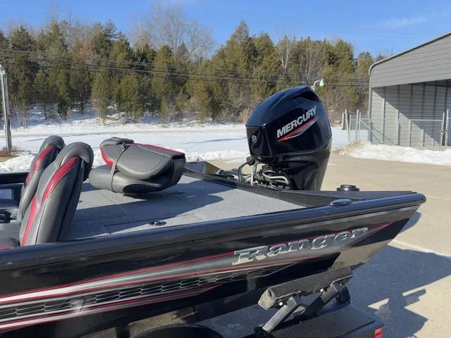 Slide: The Image of 2021 Ranger RT178 boat with Mercury engine, parked outdoors in winter setting. - 11
