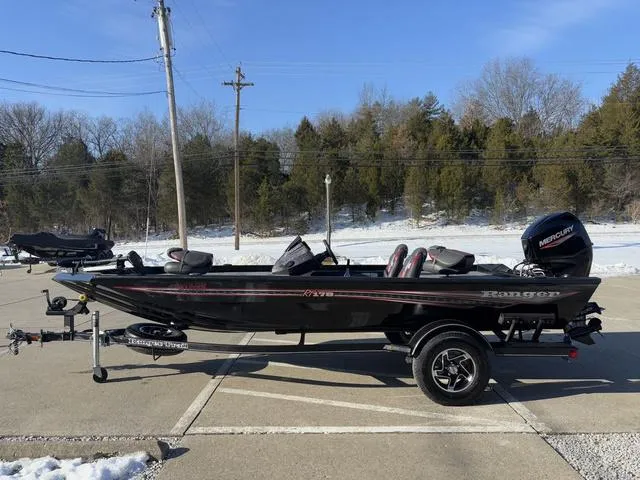Slide: The Image of 2021 Ranger RT178 boat on trailer, parked outdoors in a snowy setting. - 14