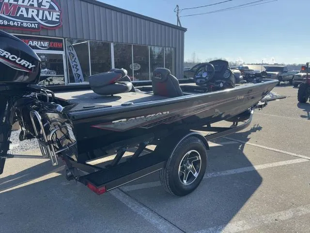 Slide: The Image of 2021 Ranger RT178 boat with Mercury engine parked outside a marine shop. - 3