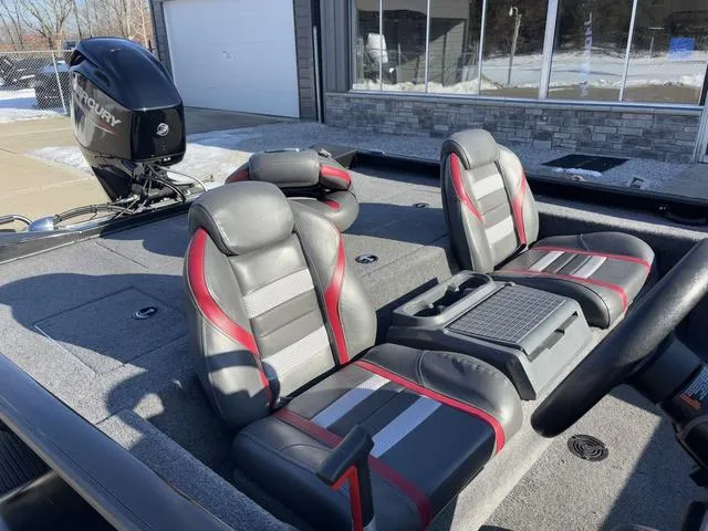 Slide: The Image of 2021 Ranger RT178 boat interior with gray and red seats, Mercury engine visible. - 5