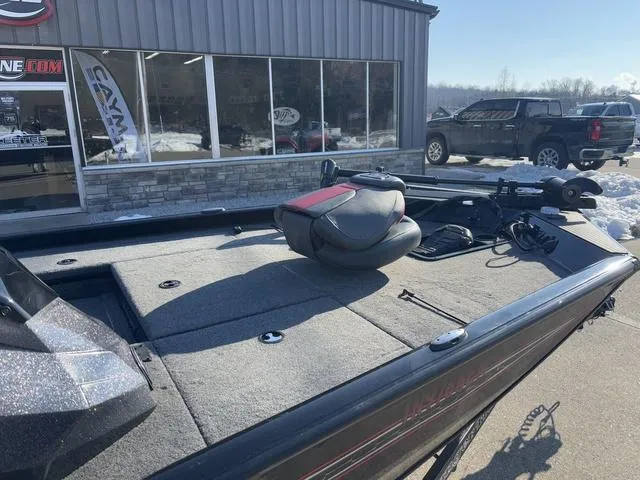 Slide: The Image of 2021 Ranger RT178 boat with spacious deck, parked outside dealership in winter setting. - 6