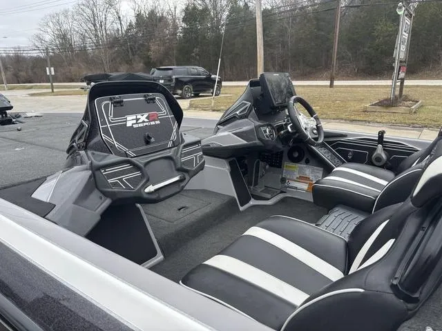 Slide: The Image of 2020 Skeeter FXR20 Limited boat interior with black and white seating, dashboard, and steering wheel. - 14