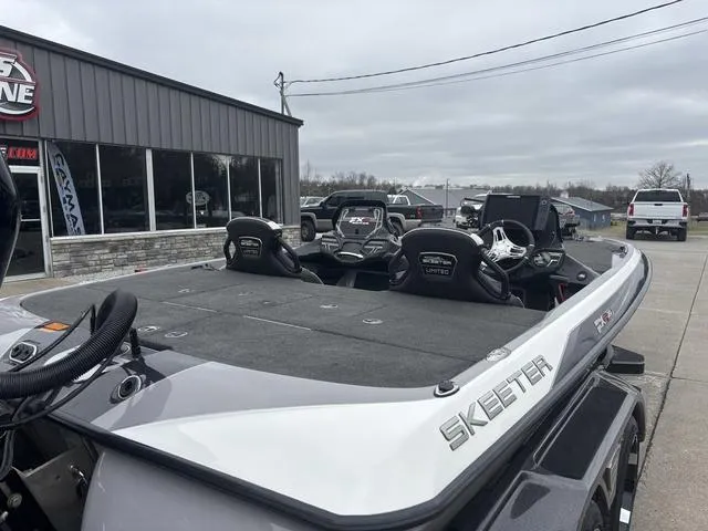 Slide: The Image of 2020 Skeeter FXR20 Limited boat parked outside a dealership on a cloudy day. - 4