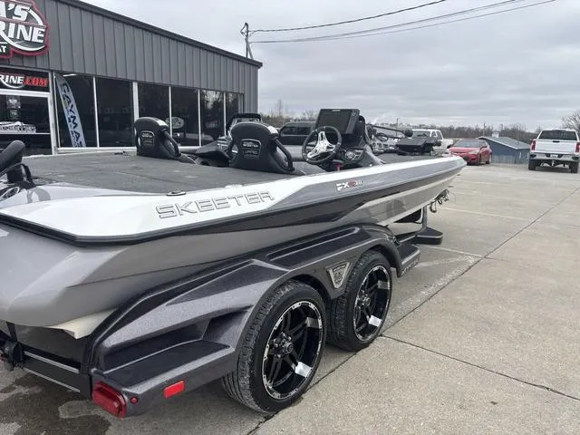 Slide: The Image of 2020 Skeeter FXR20 Limited boat on trailer in parking lot. - 5
