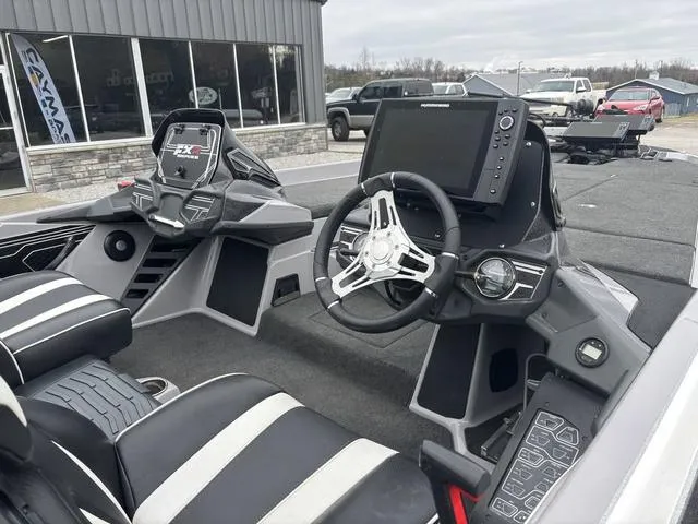 Slide: The Image of 2020 Skeeter FXR20 Limited boat interior with steering wheel and control panel. - 6