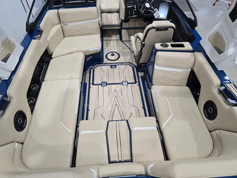 Slide: The Image of 2025 Supra SV boat interior with beige seating and modern design. - 19