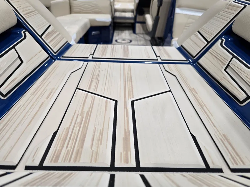 Slide: The Image of 2025 Supra SV interior with modern, geometric design and beige seating. - 25