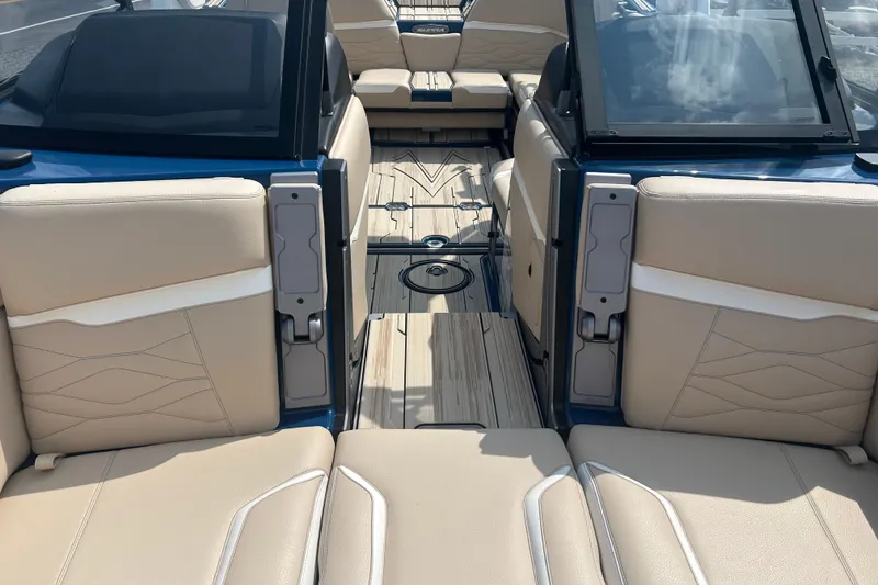 Slide: The Image of 2025 Supra SV boat interior with beige seating and sleek design. - 27