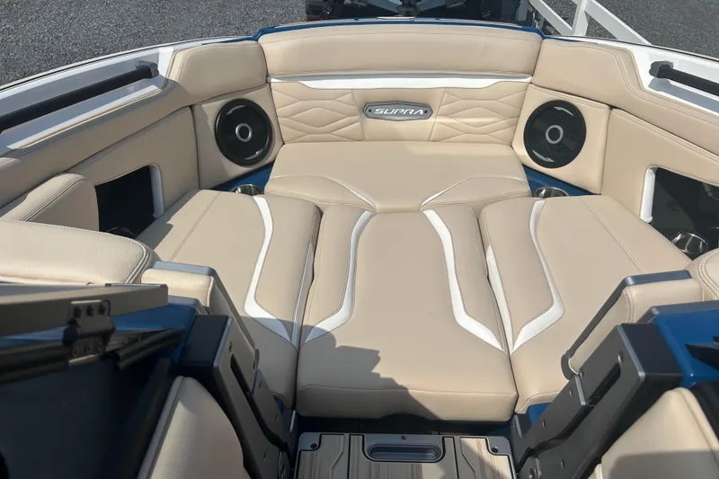 Slide: The Image of 2025 Supra SV boat interior with beige seating and built-in speakers. - 29