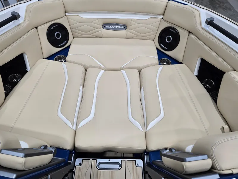 Slide: The Image of 2025 Supra SV boat interior with beige leather seating and built-in speakers. - 30