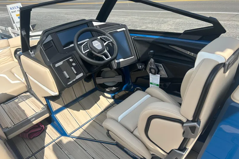 Slide: The Image of 2025 Supra SV boat interior with modern dashboard and beige seating. - 36