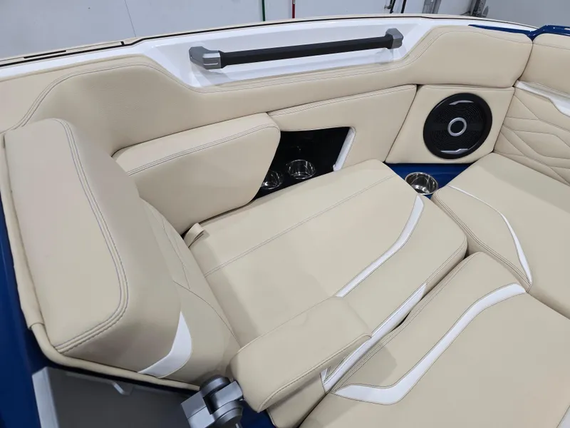Slide: The Image of 2025 Supra SV boat interior with beige leather seats and built-in speaker system. - 41