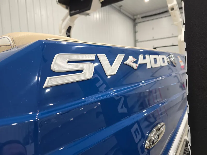 Slide: The Image of 2025 Supra SV boat with SV 400 logo in a garage setting. - 7