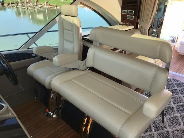 Slide: The Image of Luxurious seating on 2010 Sea Ray 610 Sundancer yacht with beige leather upholstery. - 13