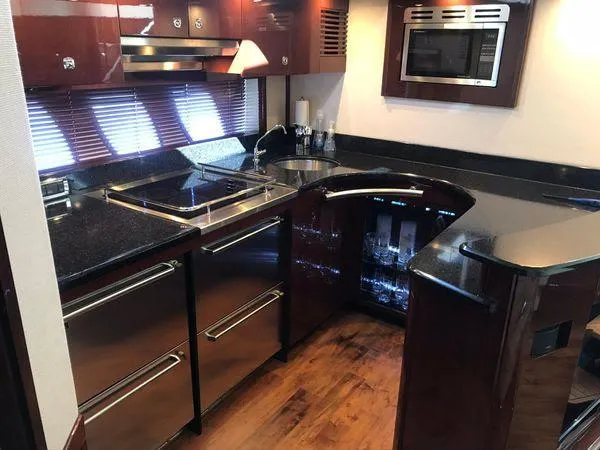 Slide: The Image of Luxurious kitchen interior of 2010 Sea Ray 610 Sundancer yacht with modern appliances. - 17