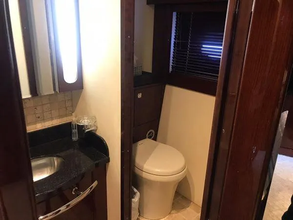 Slide: The Image of Luxurious bathroom in 2010 Sea Ray 610 Sundancer yacht with modern fixtures. - 18