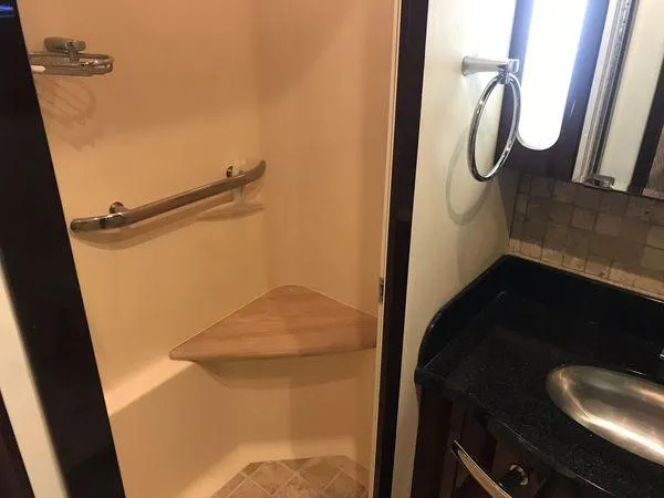 Slide: The Image of Luxurious bathroom in 2010 Sea Ray 610 Sundancer yacht with modern fixtures. - 19