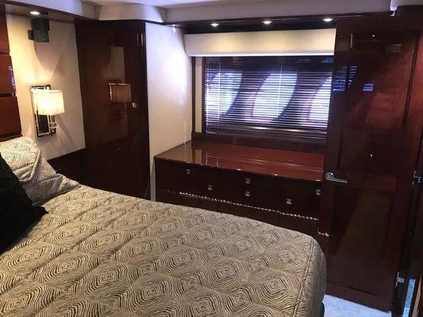 Slide: The Image of Luxurious cabin interior of 2010 Sea Ray 610 Sundancer yacht with elegant wood finishes. - 21