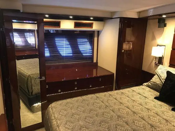 Slide: The Image of Luxurious cabin interior of 2010 Sea Ray 610 Sundancer yacht with elegant wood finishes. - 22