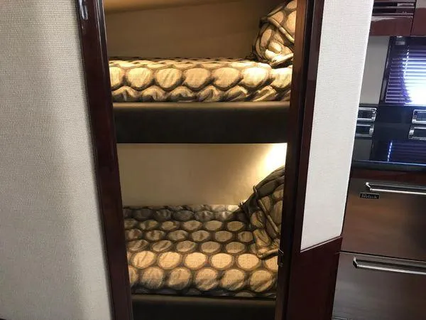 Slide: The Image of Bunk beds in 2010 Sea Ray 610 Sundancer yacht interior. - 24