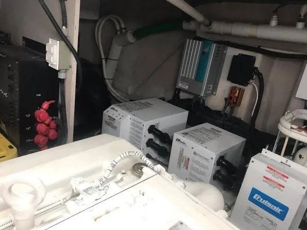 Slide: The Image of Engine room of 2010 Sea Ray 610 Sundancer with electrical components and wiring. - 28