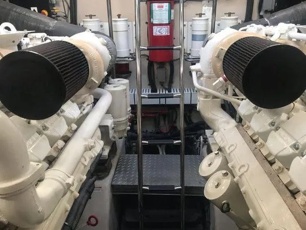 Slide: The Image of Engine room of 2010 Sea Ray 610 Sundancer yacht, featuring dual engines and equipment. - 29