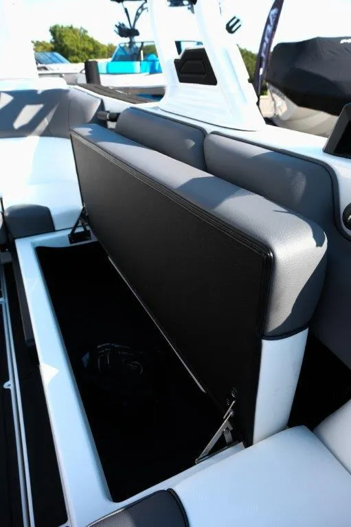 Slide: The Image of 2025 Moomba Max boat interior with open storage compartment. - 12