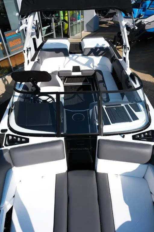 Slide: The Image of 2025 Moomba Max boat interior with sleek seating and modern dashboard design. - 16