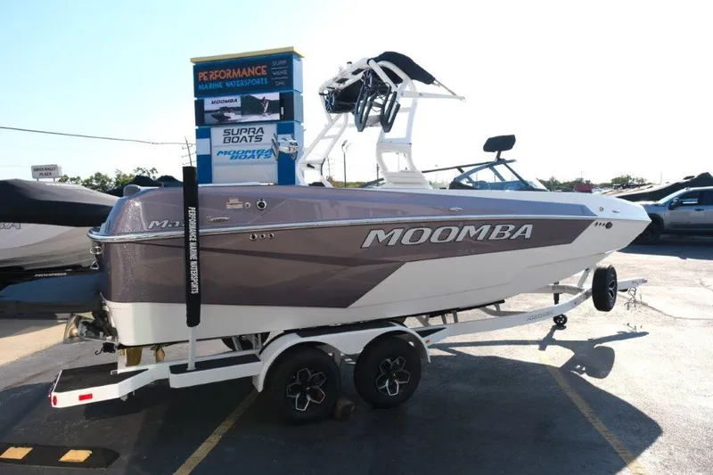 Slide: The Image of 2025 Moomba Max boat on trailer, displayed outdoors. - 4