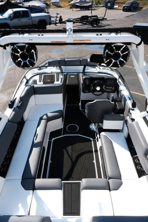 Slide: The Image of 2025 Moomba Max boat interior with sleek seating and modern dashboard design. - 8