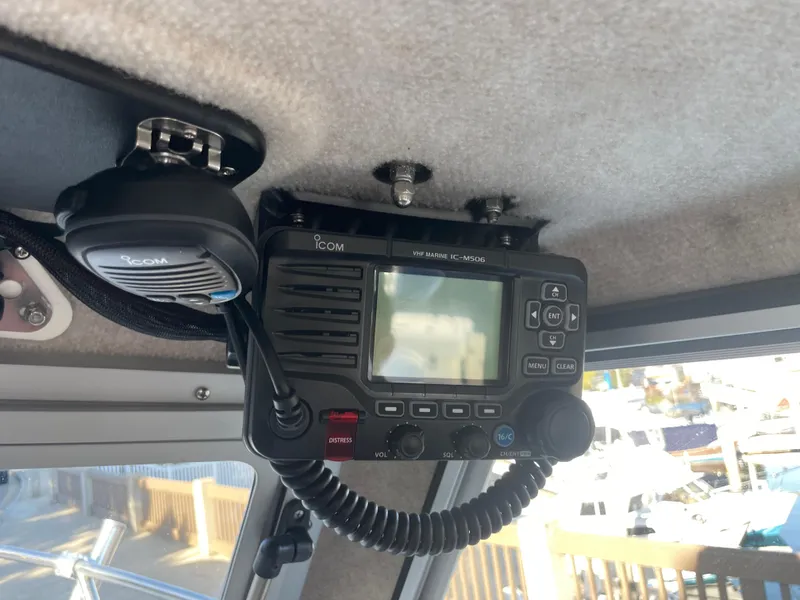 Slide: The Image of 2020 Parker 2320 Sport Cabin with Icom marine radio installed on the ceiling. - 29
