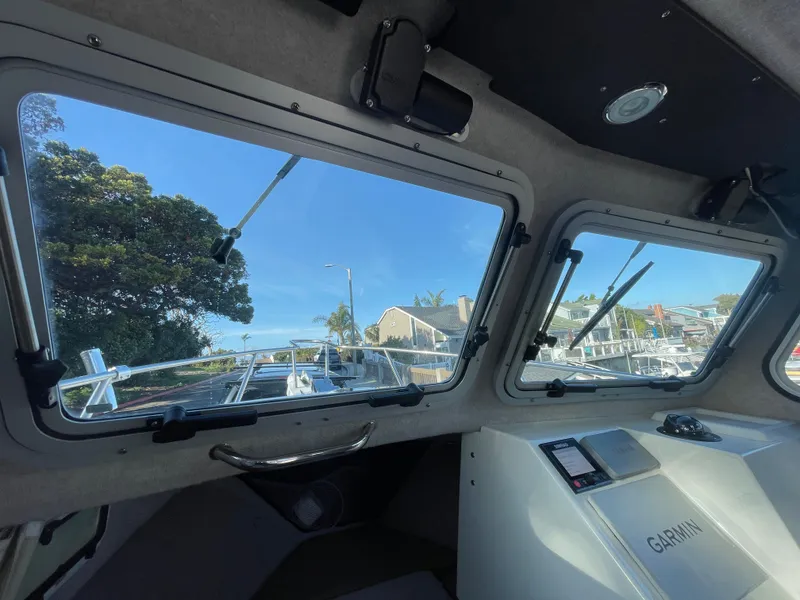 Slide: The Image of Interior view of 2020 Parker 2320 Sport Cabin boat with Garmin navigation system. - 30