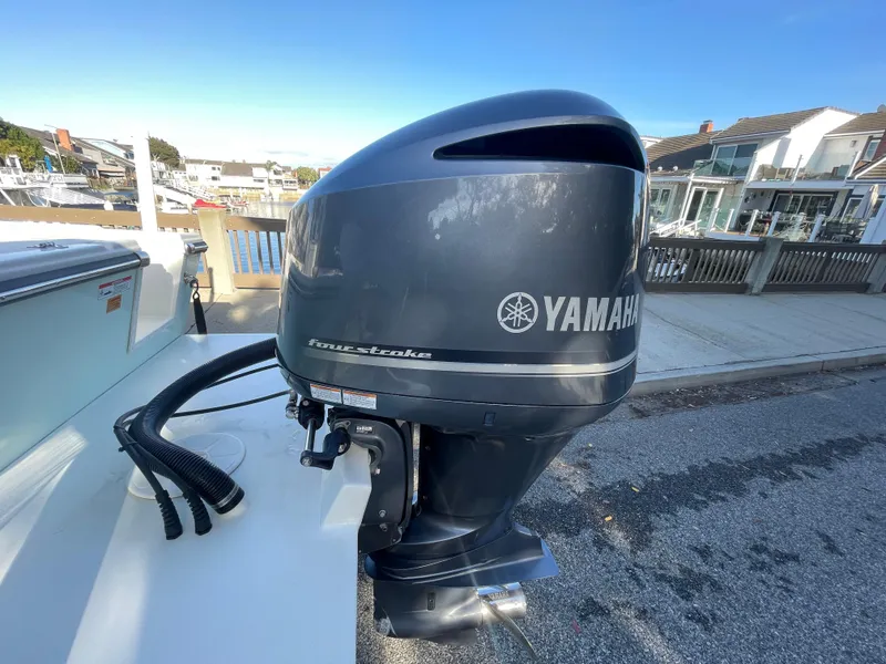 Slide: The Image of Yamaha outboard motor on a 2020 Parker 2320 Sport Cabin boat, dockside view. - 33