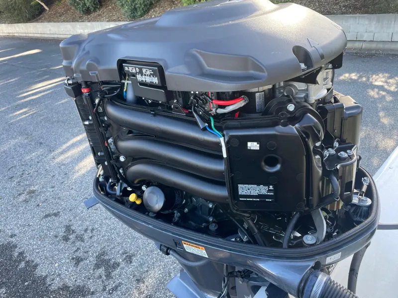 Slide: The Image of 2020 Parker 2320 Sport Cabin outboard motor, detailed view of engine components. - 35