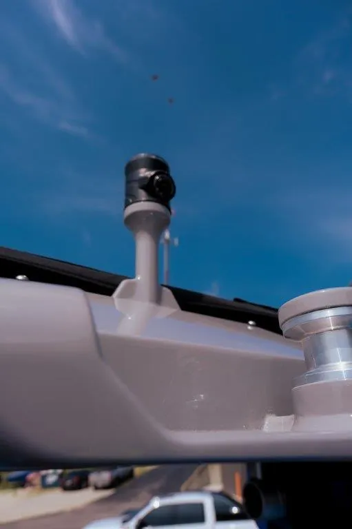 Slide: The Image of 2025 Moomba Max boat detail against blue sky background. - 12