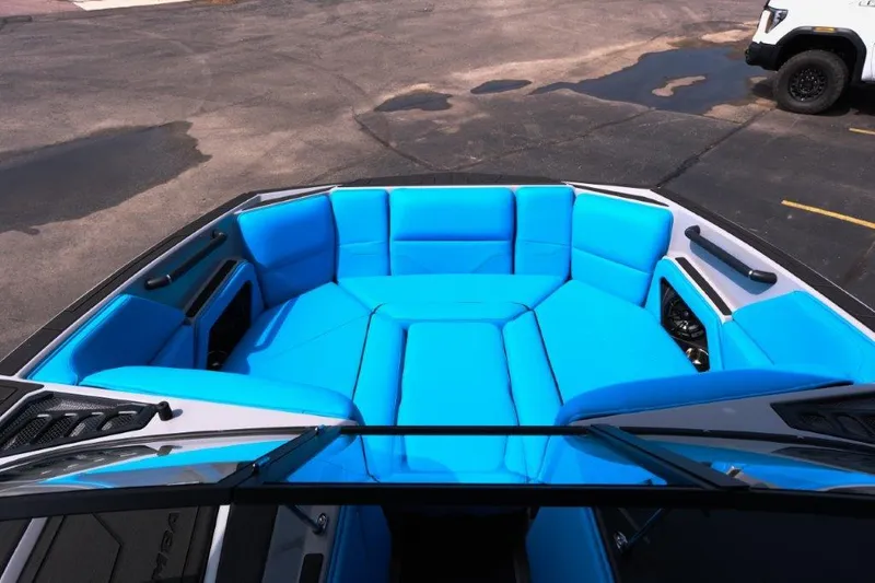 Slide: The Image of 2025 Moomba Max boat with vibrant blue seating in the bow area. - 17