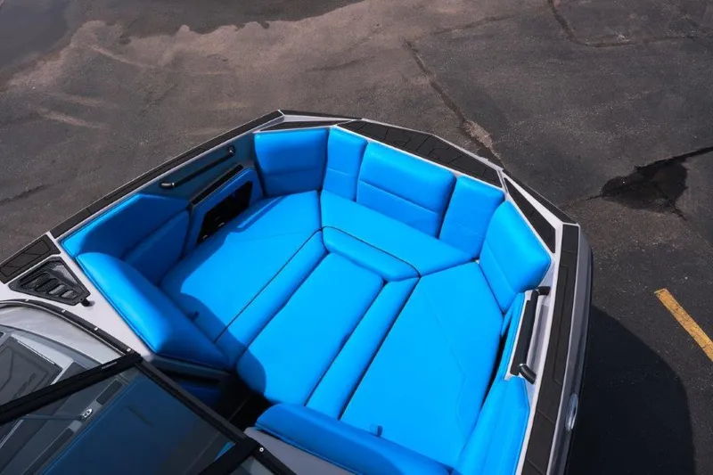 Slide: The Image of 2025 Moomba Max boat with vibrant blue seating in the bow area. - 18