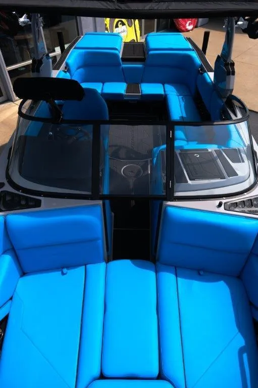 Slide: The Image of 2025 Moomba Max boat with vibrant blue seating and sleek design. - 20