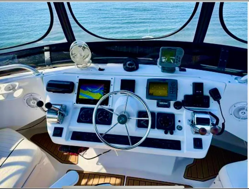 Slide: The Image of Cockpit of 1999 Mainship 350 Trawler with navigation equipment and steering wheel. - 68