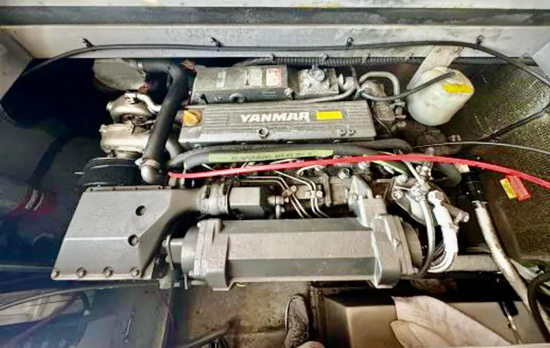 Slide: The Image of Engine of a 1999 Mainship 350 Trawler, featuring a Yanmar diesel engine. - 89