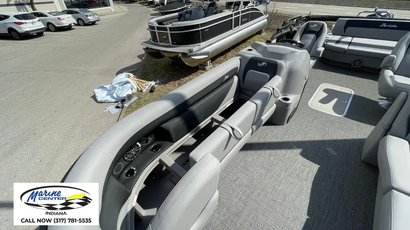 Slide: The Image of 2025 Barletta Aria A24UC pontoon boat interior with gray seating, displayed at Marine Center Indiana. - 12